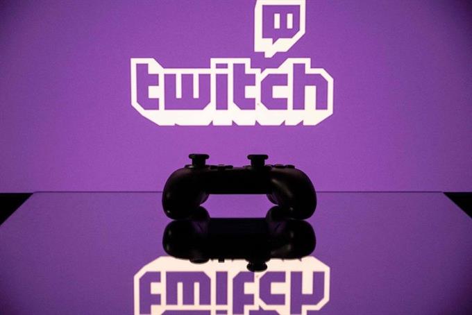 Game controller in front of Twitch TV logo