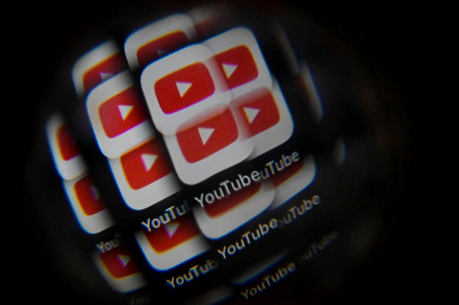 Multiple YouTube logos stacked on top of one another on a smartphone screen