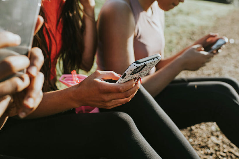 Stock art of teens using their phones